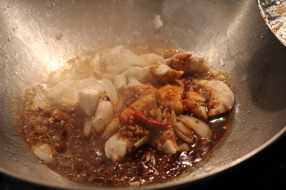 cooking vegetables in a wok