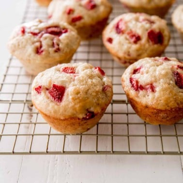 strawberry banana muffins on a wire rack