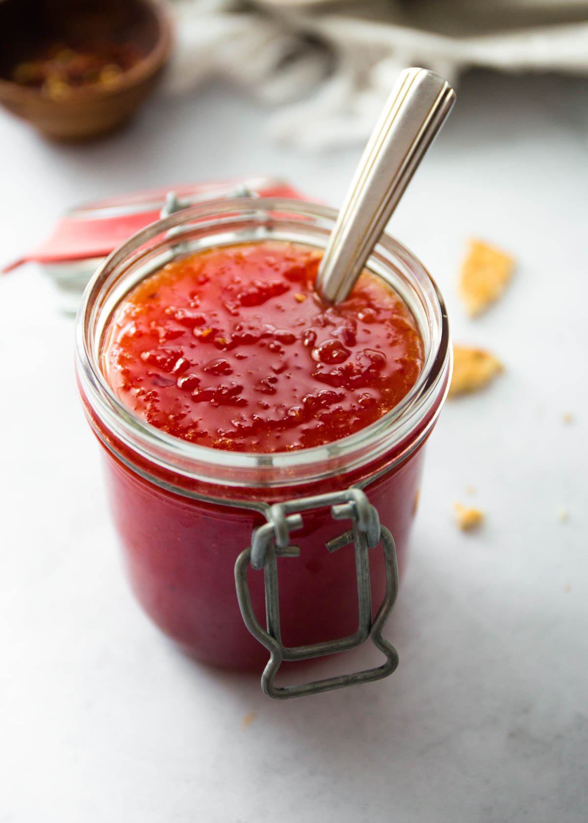 a jar of jelly on a white countertop