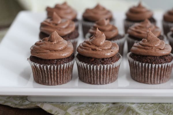 Sour Cream Fudge Cupcakes with Nutella Frosting on a white rectangular tray