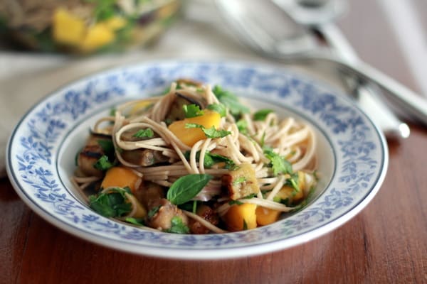 Soba Noodles with Eggplant and Mango in a blue and white bowl