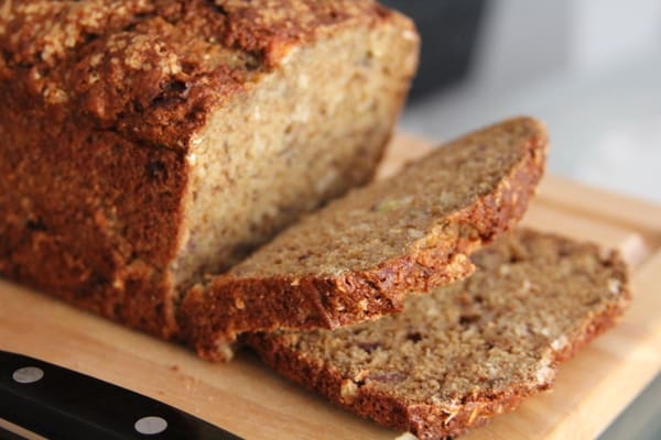 slices of Banana Bread on a wooden cutting board