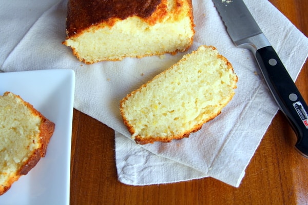 sliced yogurt cake on a white kitchen towel