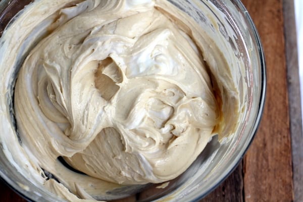 peanut butter frosting in a clear glass bowl