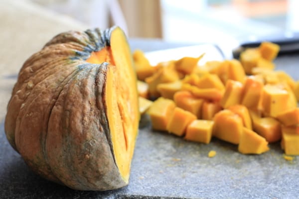 cubed butternut squash on a grey countertop