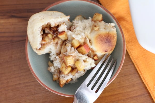 Apple cinnamon pull apart bread on a plate with a fork 