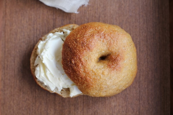 bagel with cream cheese on a wooden table
