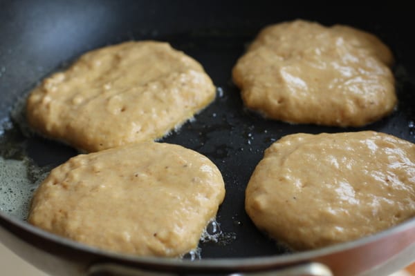 pancakes cooking in a skillet