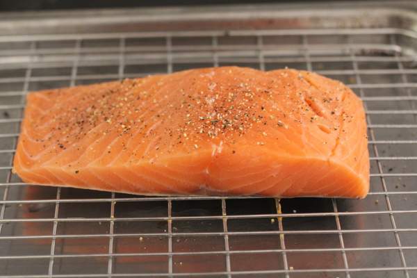 Raw salmon on a wire rack