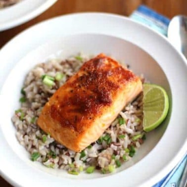 salmon and rice in a white bowl
