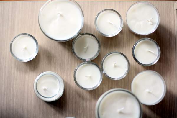 overhead image of soy candles in glass jars