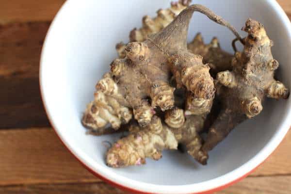 sunchokes in a white bowl