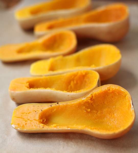 baked squash halves on a countertop