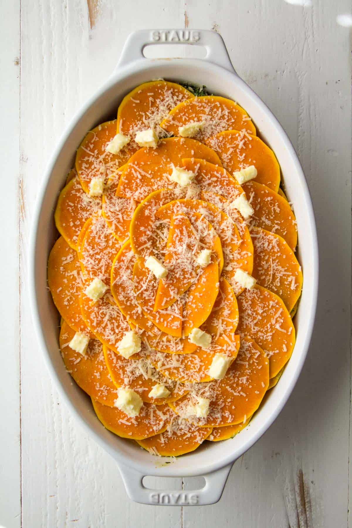 overhead image of uncooked casserole in a white baking dish