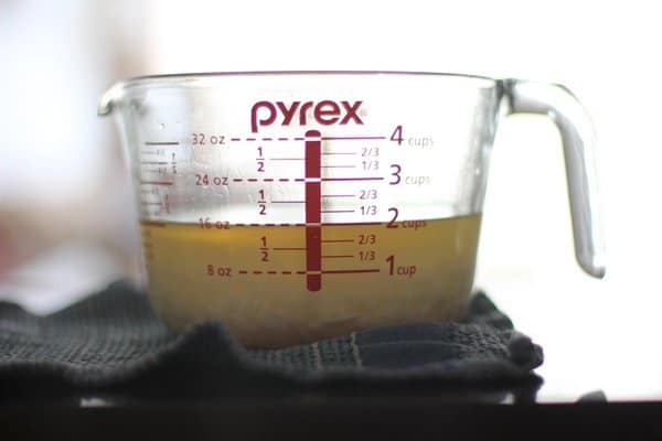melted wax in a 4-cup glass measuring cup