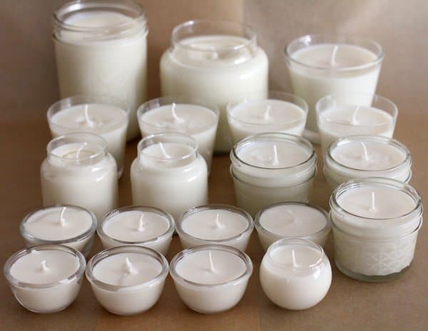 white soy candles in various jars