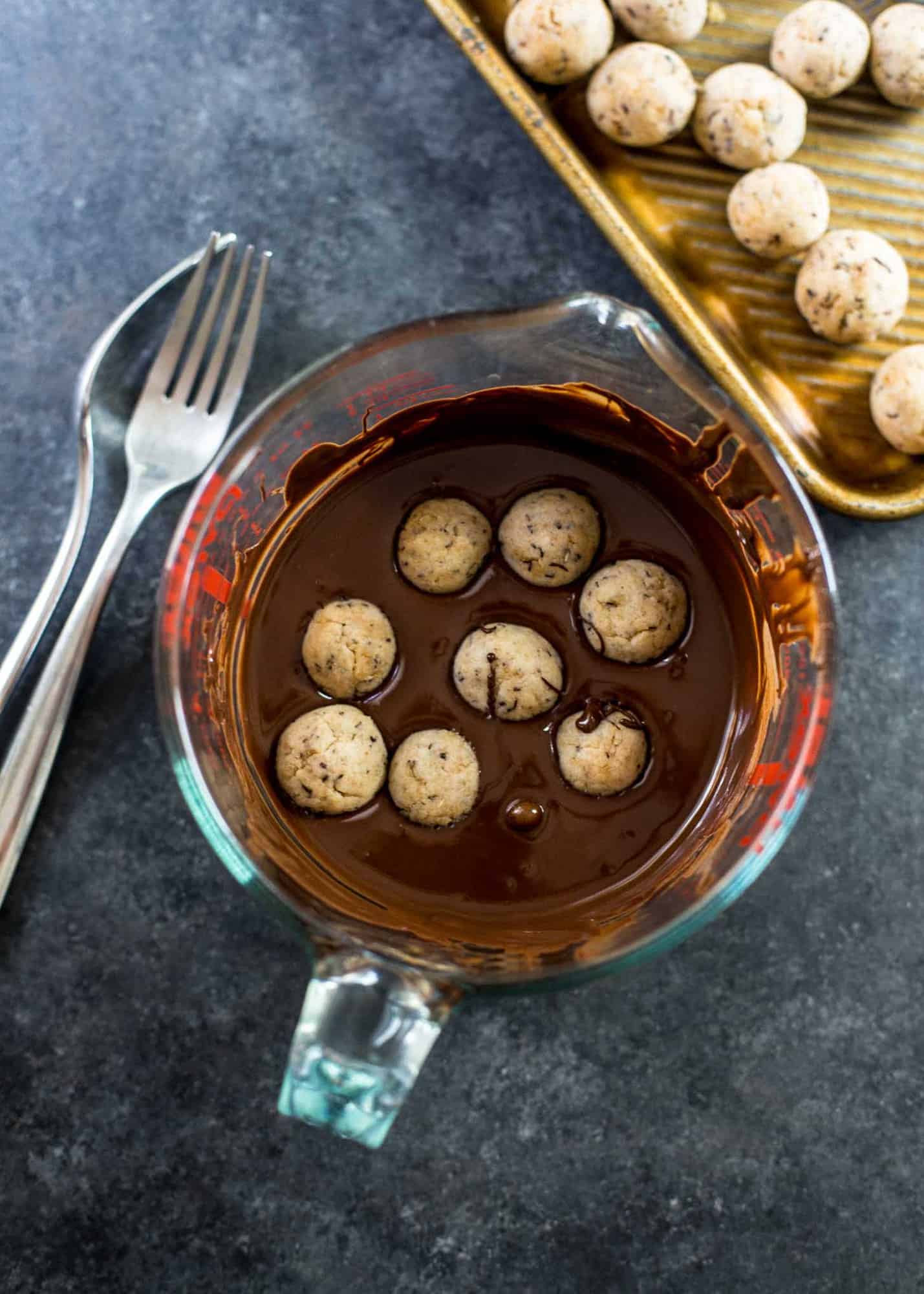 overhead image of rolling truffles in chocolate