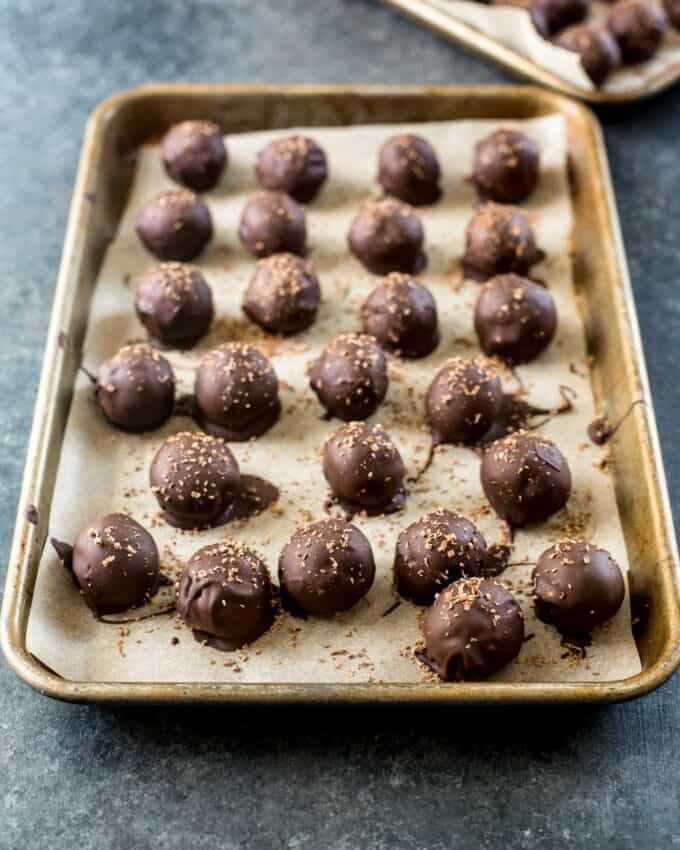 truffles cooling on a parchment lined sheet pan