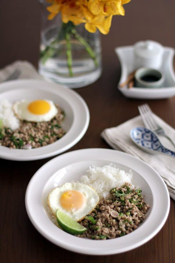 pork salad, rice and fried eggs in white bowls