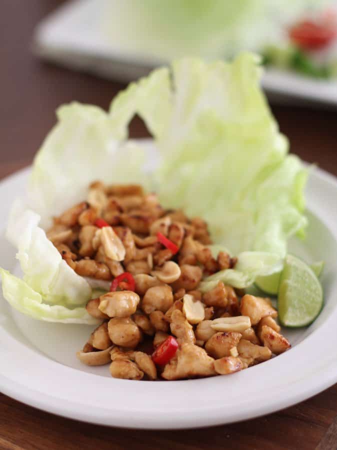 lettuce and chicken on a white plate