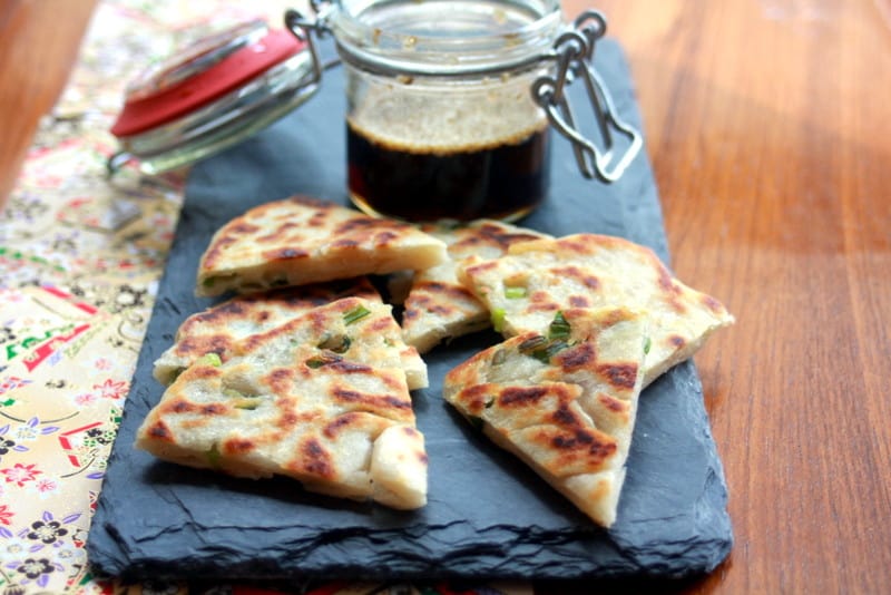 scallion pancakes on a blue towel