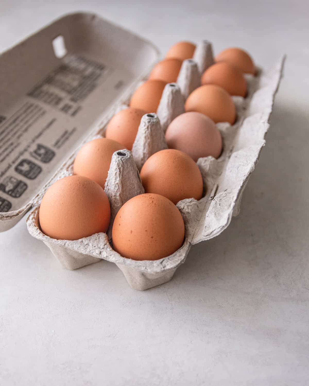 brown eggs in an egg carton