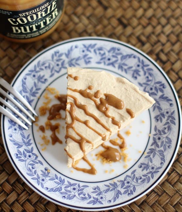 a slice of no bake cheesecake on a blue and white plate with a fork