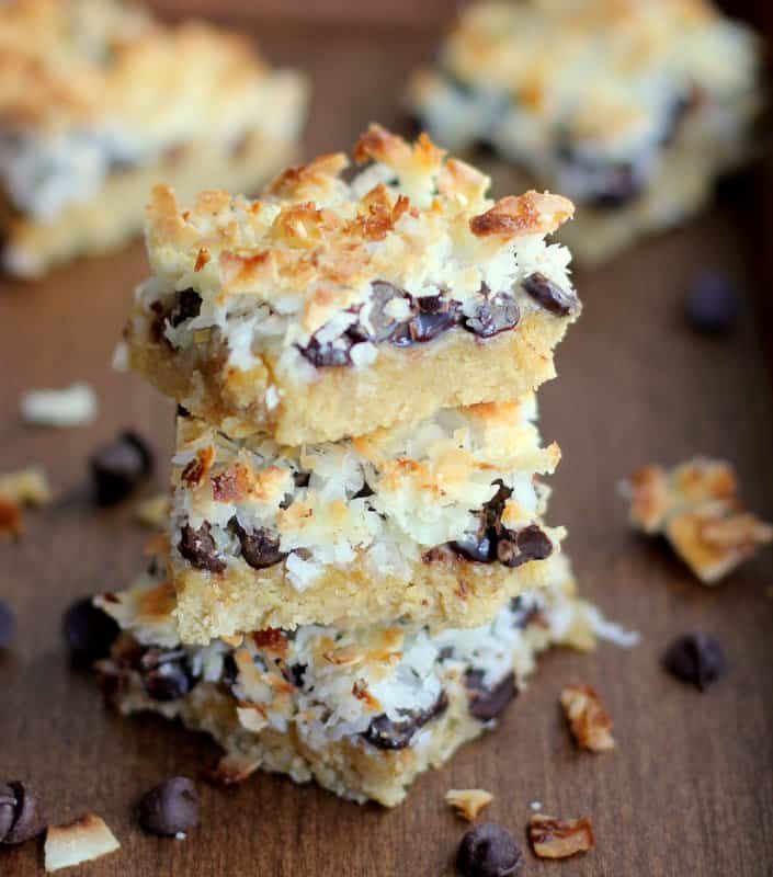 coconut bars stacked on a wooden table