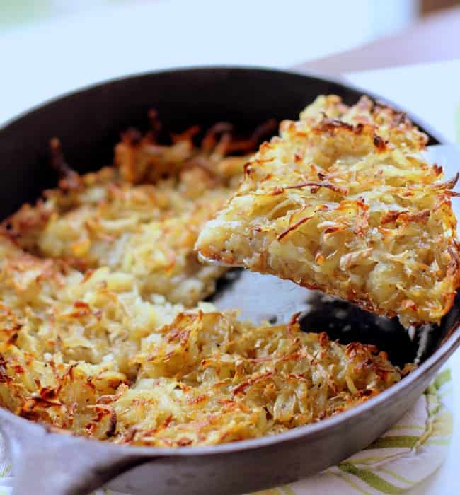 lifting hash browns out of a pan