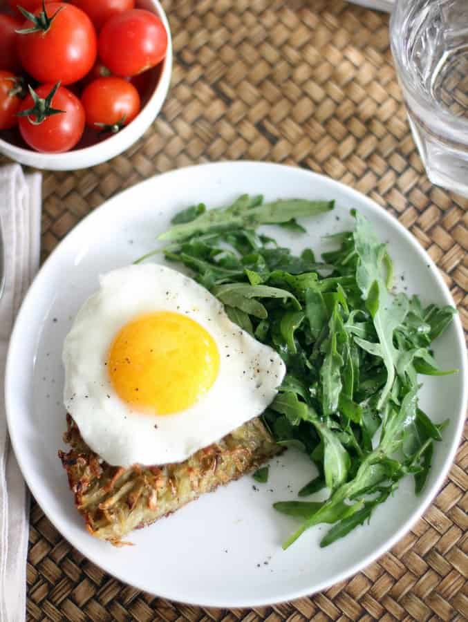 Crispy Skillet Hash Browns on a plate with a fried egg