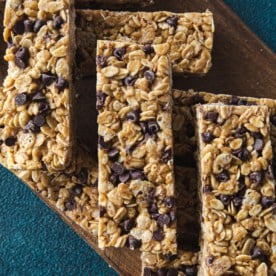 no bake granola bars stacked on a wooden tray