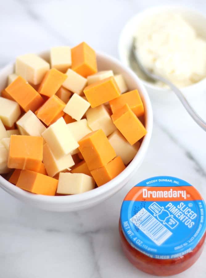 cheese and pimientos on a marble countertop