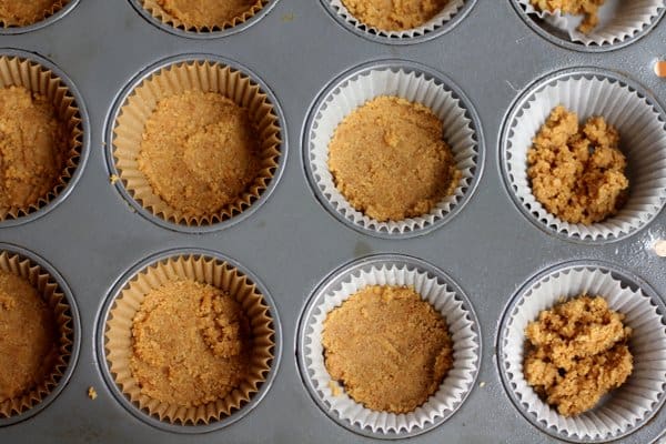 adding crust to muffin tins