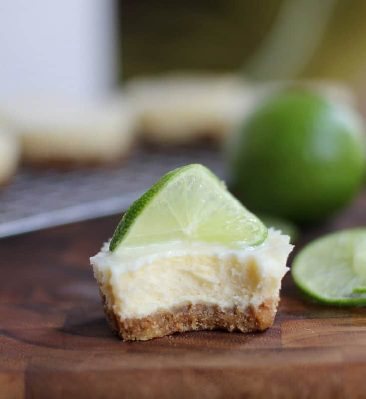 a mini cheesecake with a bite taken out of it