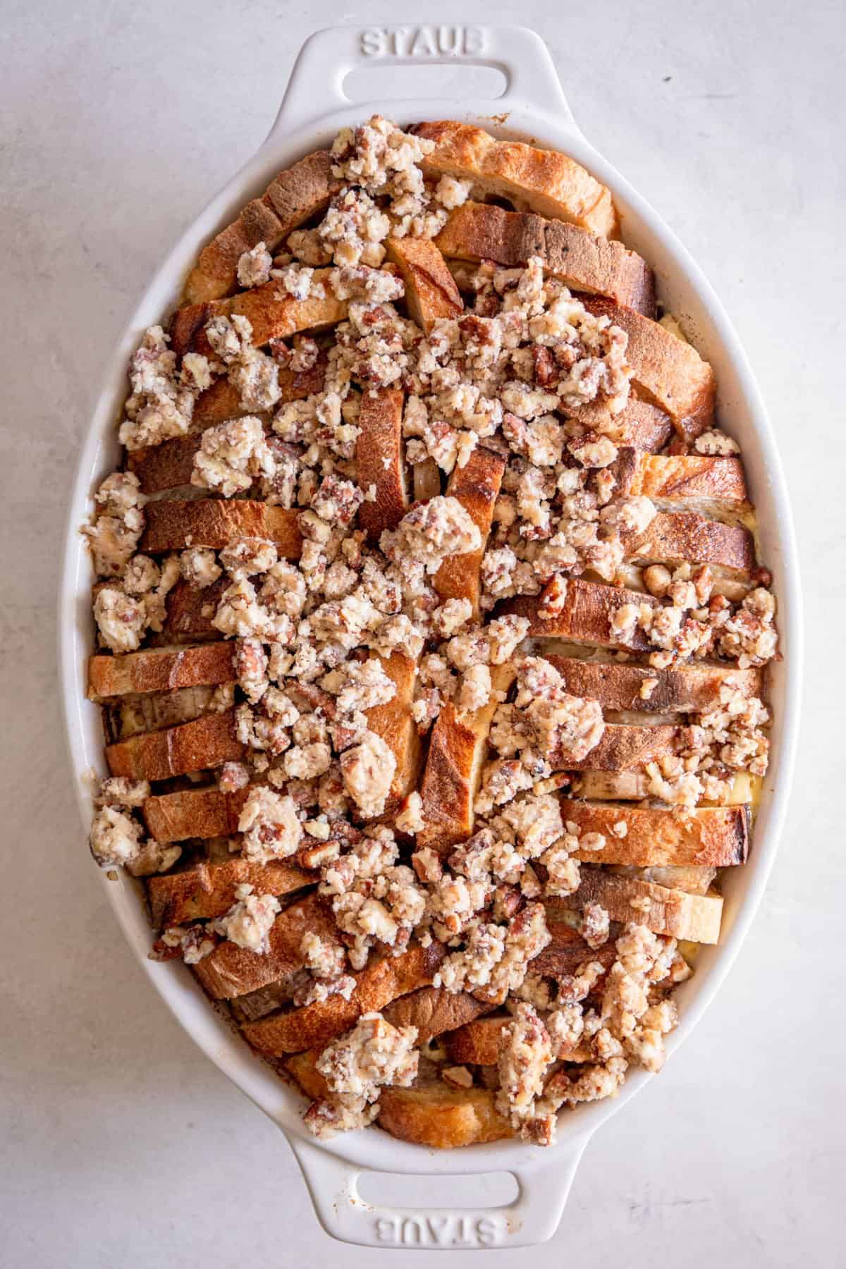 overhead image of unbaked baked banana french toast in a casserole dish