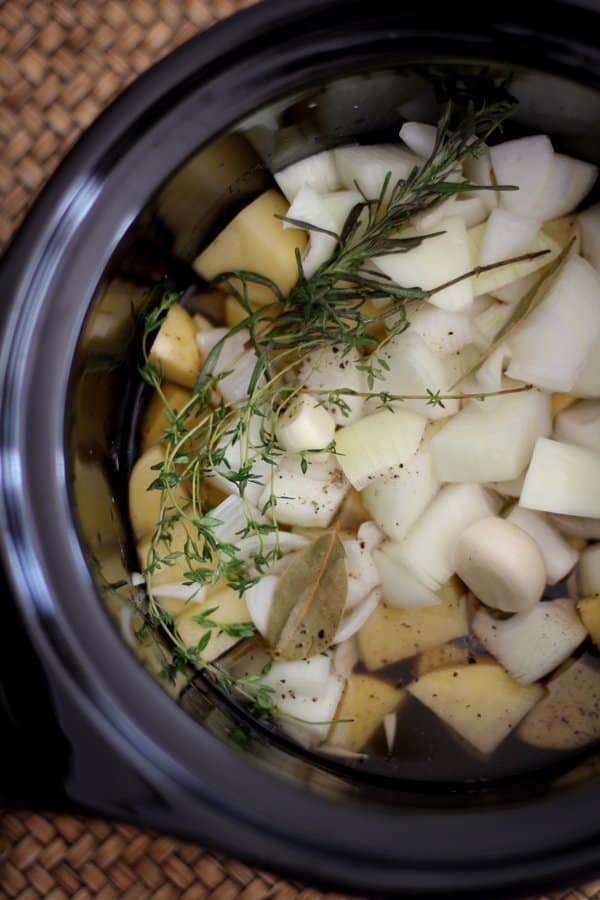 vegetables and herbs in the slow cooker