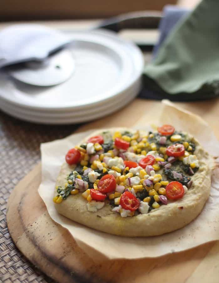 homemade pizza on a wooden tray