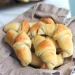 crescent rolls in a towel lined basket