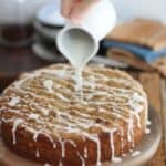 adding icing to crumb cake