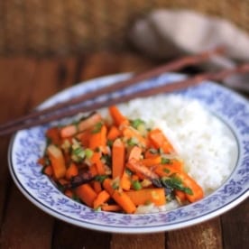 ginger carrots and rice in a blue bowl