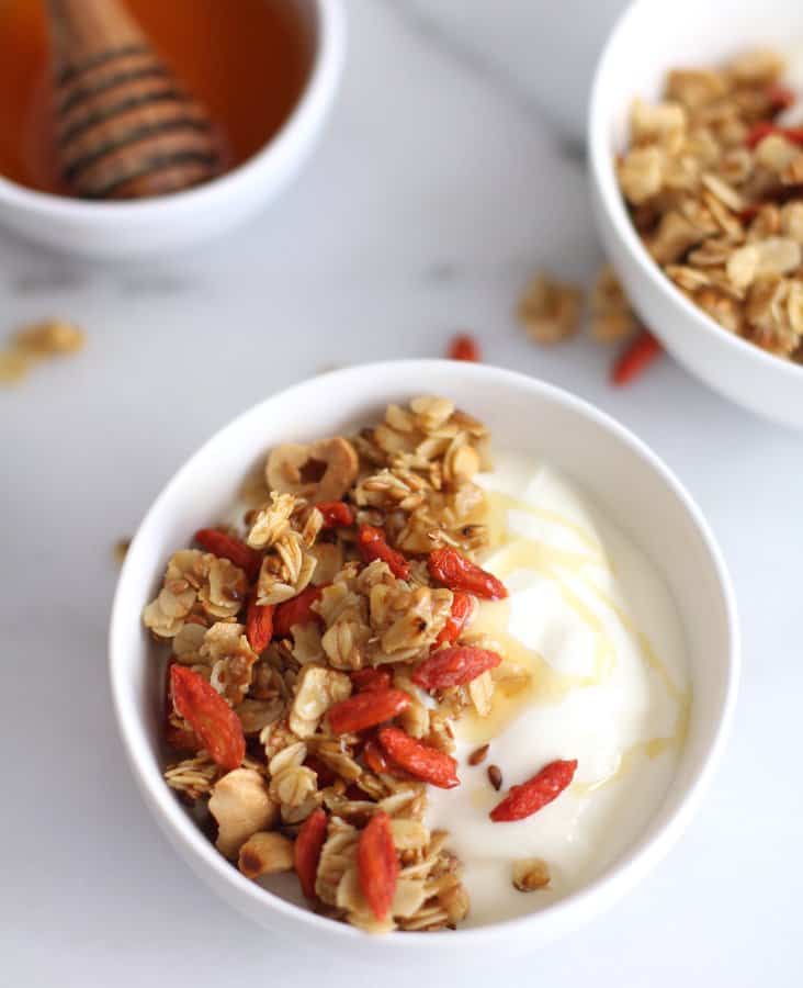 Granola and yogurt in a white bowl