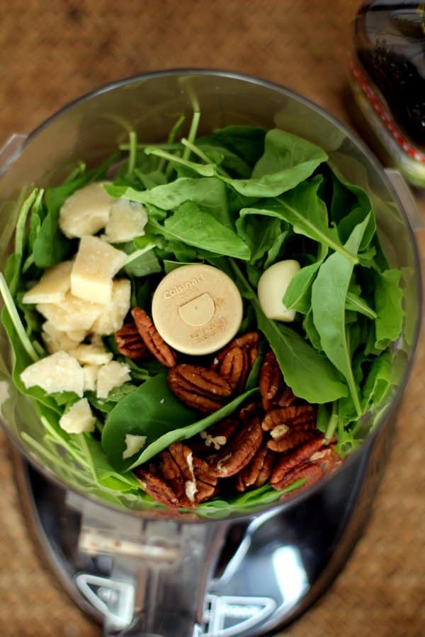 Arugula, pecans, garlic and parmesan in a food processor