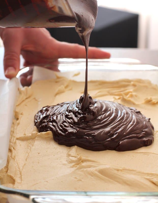 pouring chocolate over peanut butter