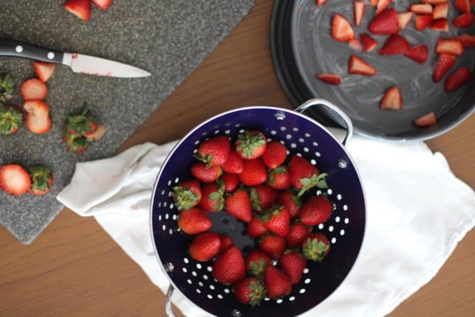 Strawberries in a blue colander