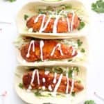 chicken tacos on a white plate