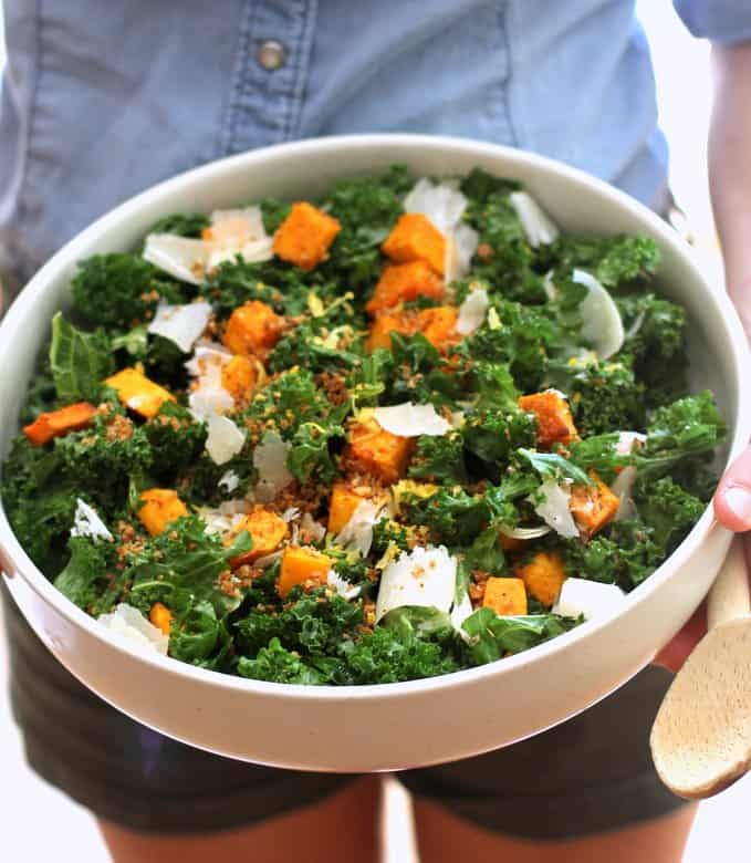 kale salad in a white bowl