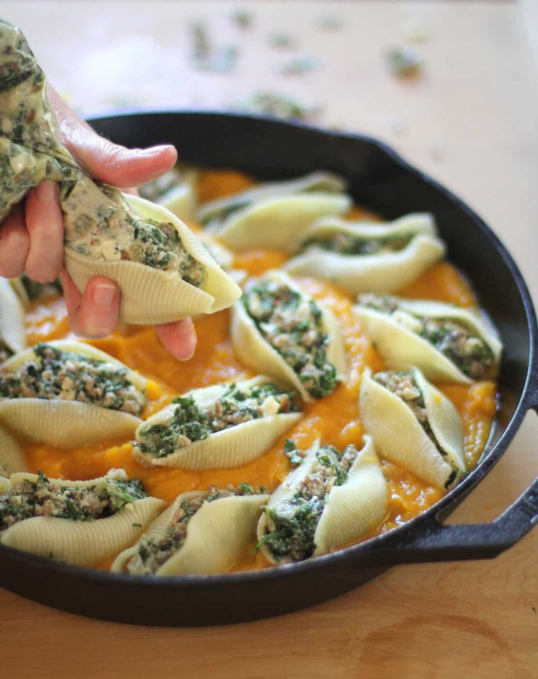 adding filling to pasta shells