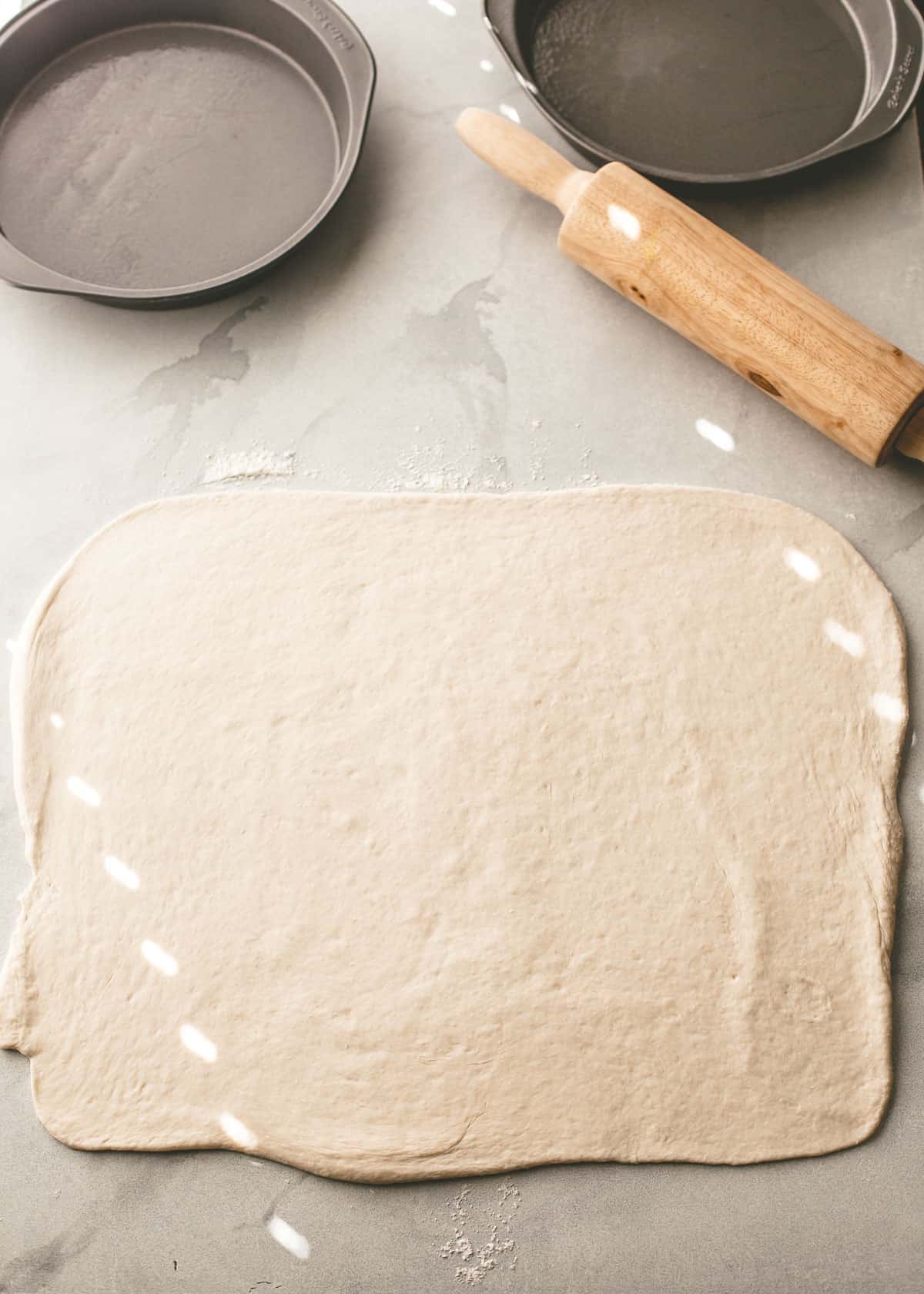 rolling dough out into a rectangle
