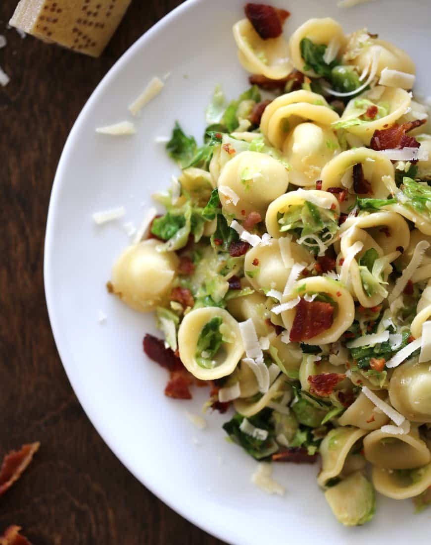 Orecchiette with Bacon and Caramelized Brussels Sprouts on a white plate