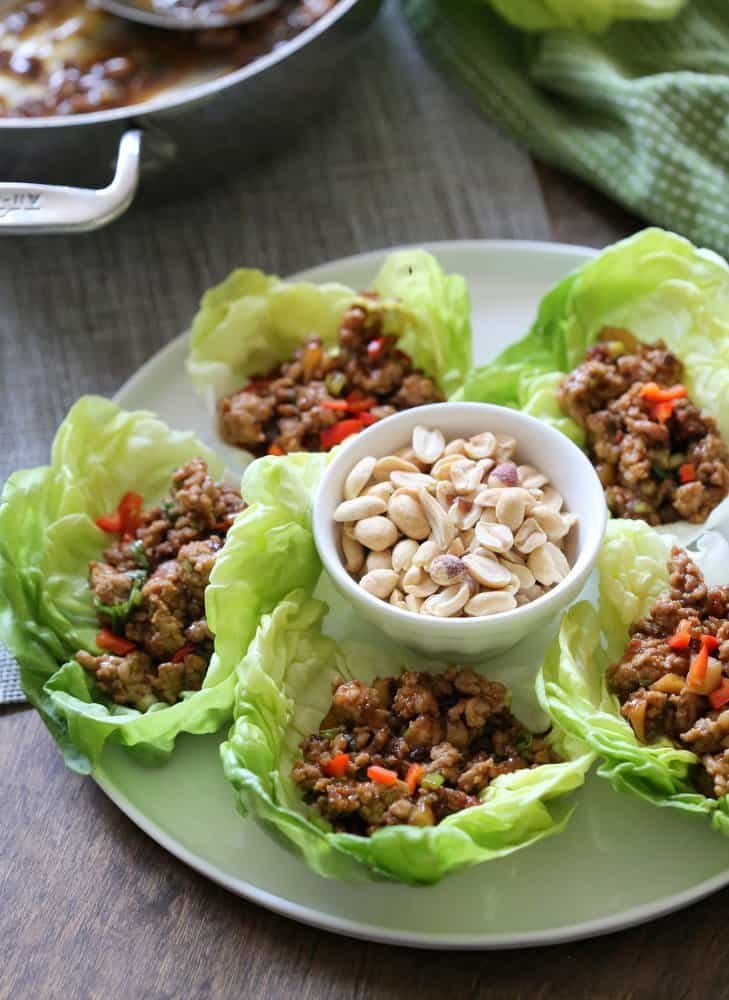 chicken lettuce cups on a white plate